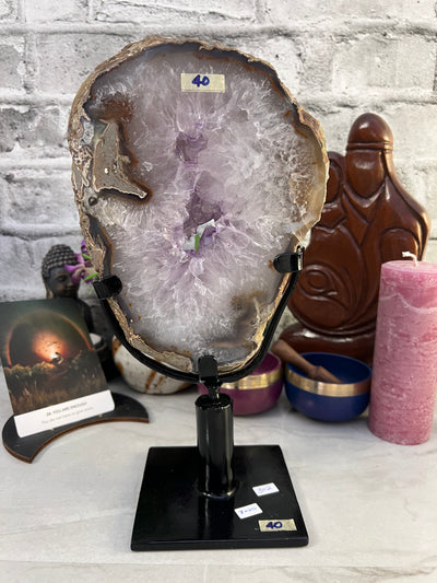 Beautiful 3 KG Amethyst Portal from Uruguay. Black metal swivel stand included