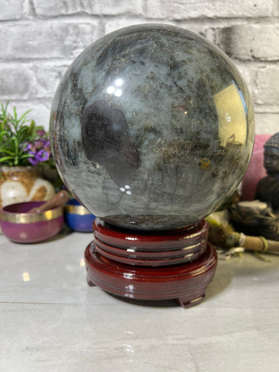 8.7 KG Labradorite Sphere with spinning wood base