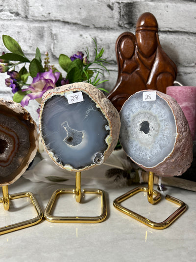 Assortment of Druzy Agate Geodes from Brazil on metal stand