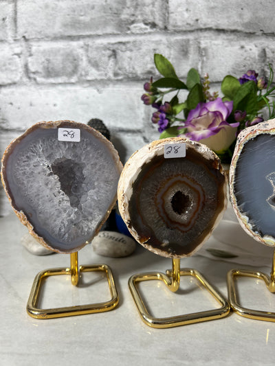 Assortment of Druzy Agate Geodes from Brazil on metal stand